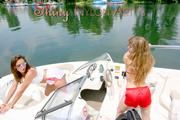 Stella and Leonie having a good time together on a boat sinbathing wearing sexy shiny nylon shorts and bikini-tops (Pics)