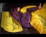 Lucy wearing a purple rain suit preparing her bed cloths for enjoying herself and the rain suit in bed lolling around (Video)