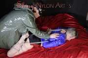 Watching sexy Sonja wearing a sexy shiny nylon shorts and a rain jacket being tied from Miss D with ropes (Pics)