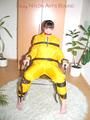 Jill tied, gagged and hooded with a tension belt on a chair wearing a supersexy yellow shiny nylon rainpants and rain jacket (Pics)