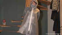 Miss Lara in nylon rain suit and transparent rain gear is bound and gagged