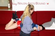 Lucy tied and gagged on a red sofa wearing a supersexy red sprinter and a blue rain jacket (Pics)