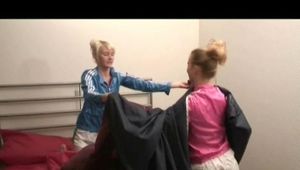 Jenny and Yvonne putting on clean bed cloths wearing sexy shiny nylon shorts and rain jackets (Video)