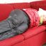 Jill tied, gagged and hooded on a red sofa wearing a black rainpants and a red rain jacket (Pics)