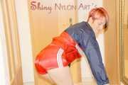 SONJA wearing a sexy red shiny nylon shorts and a red/blue rain jacket cleaning up the flat (Pics)