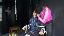 Sexy Ajyana being tied, gagged, hooded and dominated by Stella wearing sexy shiny nylon rainwear on a hairdresser´s chair Part 1 of 2 (Video)