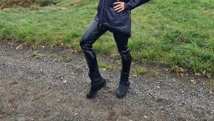 Miss Amira in blue Hunter rain jacket and patent leggings