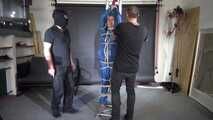 Ms ungeniert tied, gagged, suspended ind a shiny nylon Rainsuit and finally bullwhipped