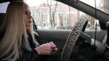 Ekaterina is smoking while driving her car