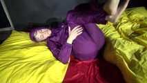 Watching sexy Sonja weraing a sexy down skirt and a down jacket putting on a sexy purple rainsuit (Video)