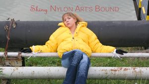 Leonie tied and gagged outdoor wearing a shiny yellow downjacket (Pics)