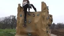 078060 Rachel Scales The Climbing Wall To Take A Pee