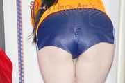 HOT HOT HOT - Lucy wearing sexy shiny nylon down shoes, a darkblue shiny nylon shorts and an orange rain jacket cleaning the studio (Pics)