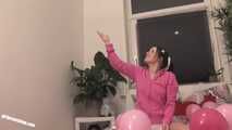 Teen Jennin plays with balloons