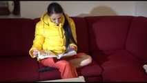 Watching sexy Lucy wearing a orange/yellow shiny nylon downwear combination reaing a magazine and lolling on the sofa (Video)