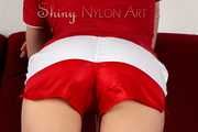 Watching our sexy archive girl wearing a sexy shiny nylon shorts posing for you (Pics)