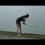 Enni taking a walk on a lake throwing stones into the water and wearing a supersexy shiny nylon shorts and a top (Video)