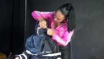 Sexy Ajyana being tied, gagged, hooded and dominated by Stella wearing sexy shiny nylon rainwear on a hairdresser´s chair Part 1 of 2 (Video)