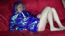Sexy Sonja preparing her bed wearing sexy shiny nylon shorts and a long rain jacket (Video)