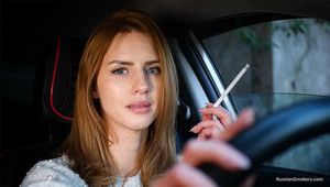 Meet Anastasia in her car while she is smoking two 120mm all white cigarettes