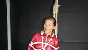 Watch Sandra enjoying Bondage in her shiny nylon Rainwear beeing noosed