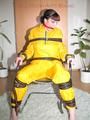 Jill tied, gagged and hooded with a tension belt on a chair wearing a supersexy yellow shiny nylon rainpants and rain jacket (Pics)