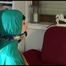 Mara tied, gagged and hooded on the back of an chair wearing a hot rain pants and a shiny nylon shorts over it and a rain jacket (Video)