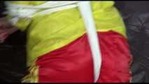 PIA tied and gagged with ropes on a sofa wearing a sexy red shiny nylon shorts and a yellow rain jacket (Video)