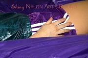 Samantha ties and gagged herself on bed wearing a shiny purple nylon shorts and a shiny green transparent rain jacket (Pics)