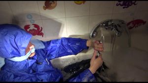 Sonja taking a bath and ties and gagges herself wearing a shiny nylon rainwear combination (Video)