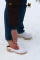 Linda with white clogs in the snow