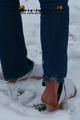 Linda with white clogs in the snow