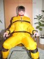 Jill tied, gagged and hooded with a tension belt on a chair wearing a supersexy yellow shiny nylon rainpants and rain jacket (Pics)