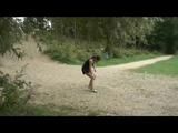 Enni wearing sexy shiny nylon shorts and top while throwing stones in a lake (Video)