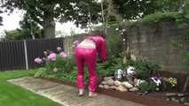 Watching Aiyana wearing supersexy pink shiny nylon rainwear while planting flowers in the garden (Video)