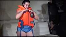 Sexy Jill shows you how to enjoy putting on and wear a lifevest over an bikini and a shiny nylon shorts (Video)