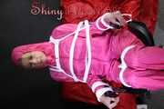 Watching sexy Pia being tied and gagged with ropes and a clothgag on a hairdressers chair wearing a very sexy pink rainwear combination with hood (Pics)