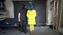 Ms Ungeniert tied, gagged and hooded in shiny nylon yellow Downjacket