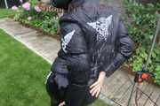 Watching Aiyana wearing a sexy black shiny nylon rainpant and a black shiny nylon down jacket trying the garden shower  (Pics)