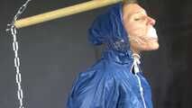 Watch Sandra bound gagged and wearing her shiny nylon Rainwear