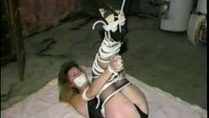 31 Yr OLD SEXY SUSIE IS TIED UP IN HER BASEMENT, TAPE GAGGED, CROTCH ROPED & LEGS TIED UP IN THE AIR (D52-16)