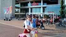 I’m cycling through Amsterdam in my mini school uniform
