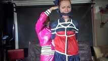 SEXY RONJA being tied and gagged and hooded from Sexy Stella both wearing sexy shiny nylon rainwear (Video) 