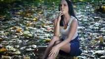 Smoking in the autumn park with lovely lady