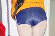 HOT HOT HOT - Lucy wearing sexy shiny nylon down shoes, a darkblue shiny nylon shorts and an orange rain jacket cleaning the studio (Pics)