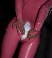 A babypink latex catsuit with Emma and a wet diaper inside