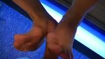 Footjob at the solarium