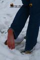 Linda with white clogs in the snow