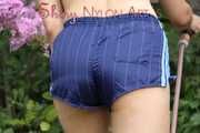 Watching Aiyana wearing only a sexy blue shiny nylon shorts watering the garden (Pics)