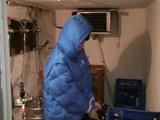 Archive girl tied, gagged and hooded in a cellar wearing a shiny light blue downcoat (Video)